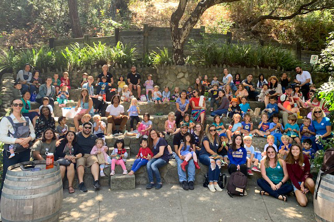 ECCES group seated outside under oak trees at the Santa Barbara Natural History Museum